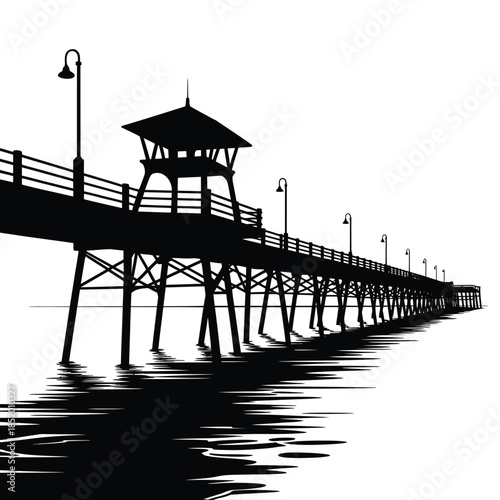 A striking silhouette of a long wooden pier extending into the ocean