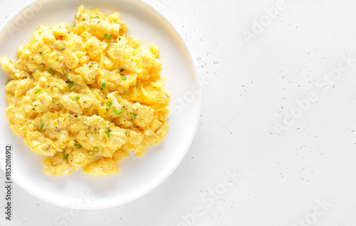 Delicious scrambled eggs on plate