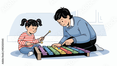 Father and daughter playing xylophone together enjoying music and bonding time.