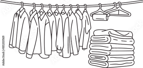 Black and white line of hanging clothes and folded towels