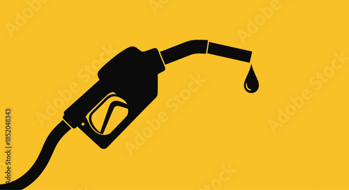 Black silhouette of a gas station fuel pump nozzle with a single drop of gasoline falling on a bright yellow background.