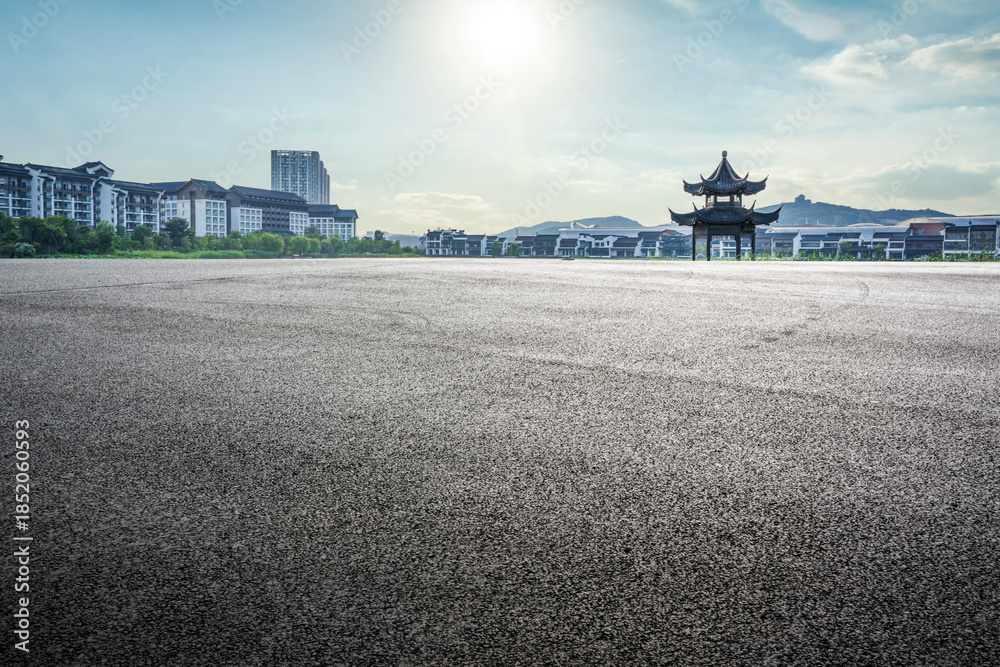 Fototapeta premium Tranquil Urban Landscape Featuring Traditional Pavilion Amidst Modern Architecture
