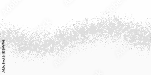 A scattering of gray dots and specks against a stark white background