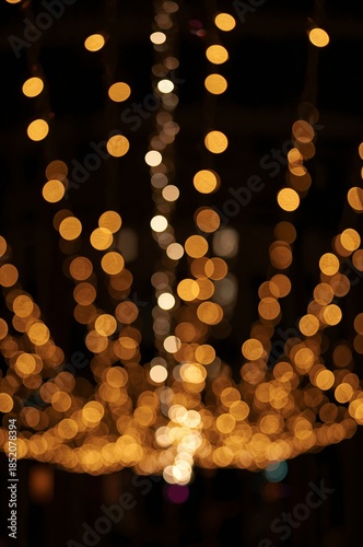 Warm Lights Hang in a City Square During an Evening Celebration