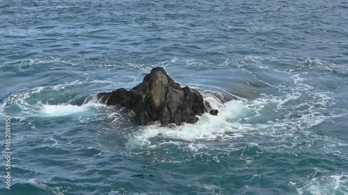  rock in the blue atlantic ocean on the coast of Porto Moniz, Madeira, Portugal 
