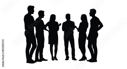 A group of people standing together facing each other in a dark silhouette