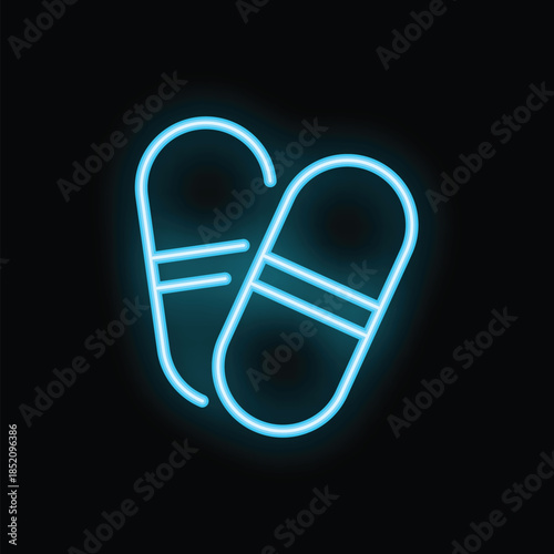 Neon blue glowing pills sign on black background representing a concept of medicine, pharmacy or drugstore