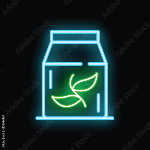 Bright neon sign of a paperboard package with tea leaves glowing on a black background