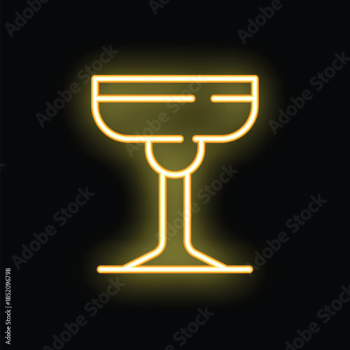 Yellow neon sign showing cocktail glass on black wall background