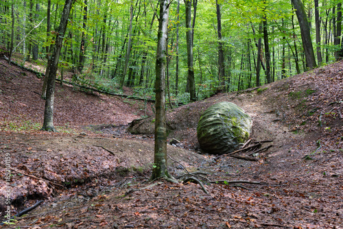 Stone sphere in forest in village Slatina near Banja Luka, mysterious sandstone ball
