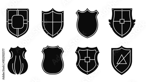 A collection of various black and white shield icons displaying different heraldic designs and shapes