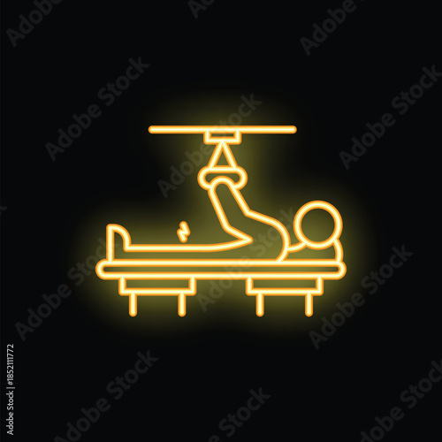 Neon sign of a patient lying on a medical bed, raising one leg with the help of suspension equipment
