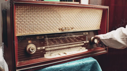 We listen to Old Radio: Turning on and searching for a radio station on an old radio