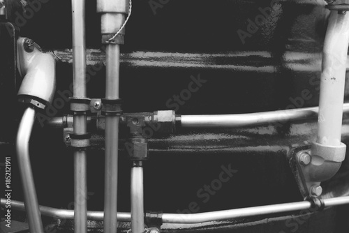 Close-up view of industrial piping system in a mechanical workshop showcasing intricate design and engineering details