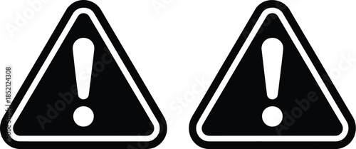 Two triangular warning signs with exclamation marks, symbolizing caution