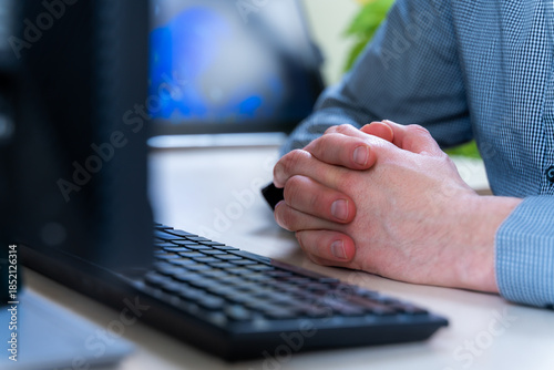 Fotografie Waiting Hands Rest By Office Keyboard During Meeting, Patience In Workflow Revie