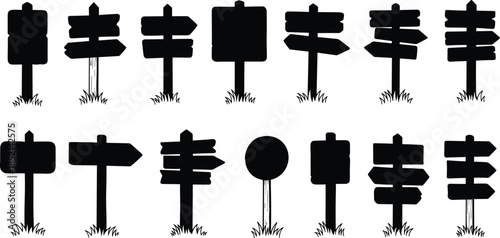 Collection of blank directional signs on grassy areas