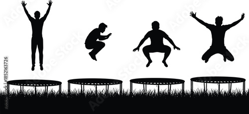 Four black silhouette figures jumping on trampolines in grass outdoor