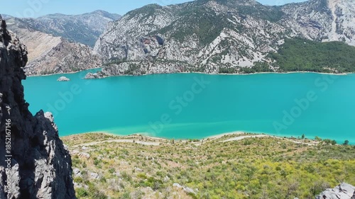 Dam lake in the Green Canyon in Turkey. Mountain lake Oymapinar. The Emerald reservoir behind the Oymapinar dam in the Manavgat region.View of the Taurus Mountains. 4К