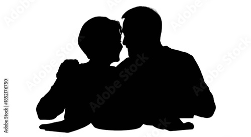 Happy senior couple sharing a pie together at a table.