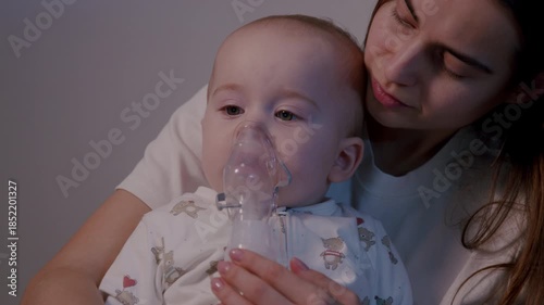 Mother gently assists her child with a nebulizer treatment, showcasing a warm and caring atmosphere, camera slowly zooms in on their intimate moment