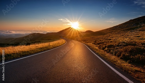 bright sunrise illuminating a winding road symbolizing the start of a new path