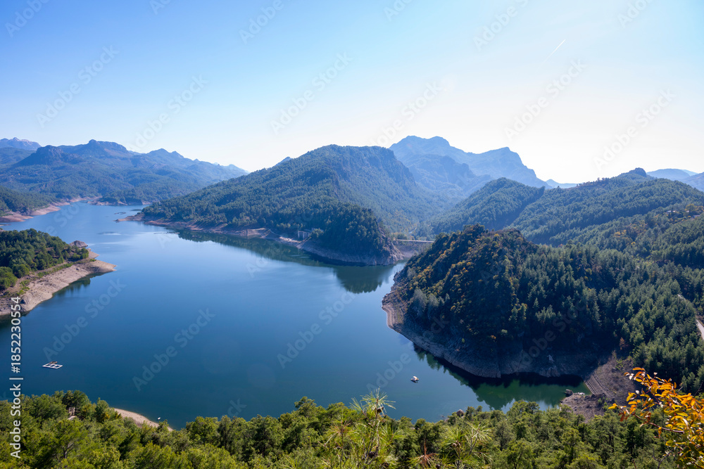 Obraz premium Scenic view of Karacaoren dam , barrage ( Karacaoren Baraj Golu ) from Karadag with Beautiful mountainous scenery with lots of nature, Burdur,Aerial panoramic view of the Karacaoren Dam Lake on the An
