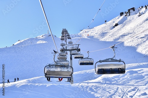 Ski lifts going up and down in Meribel  ski resort, French alps, France