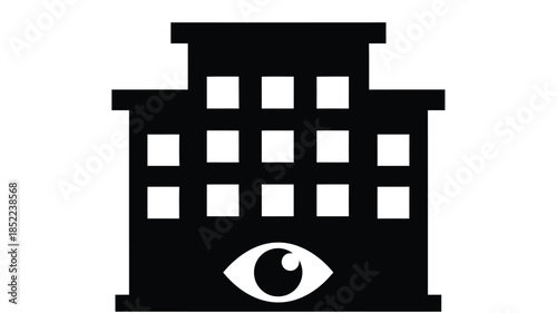 A stark black silhouette of a building featuring a prominent eye design at its base