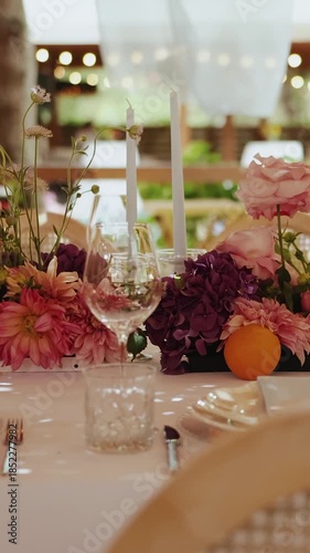 Vertical video. Romantic outdoor centerpiece, Chic wedding table decoration details, Elegant bohochic wedding table with flowers