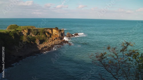 Scenic View of a Rugged Coastline with Green Cliffs