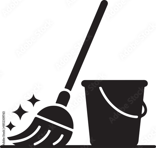 Black and white of a paintbrush dipping into a paint bucket with splashes