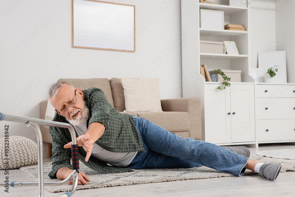 © Pixel-Shot - Senior man lying on floor after fall with walker at home © Pixel-Shot - Senior man lying on floor after fall with walker at home