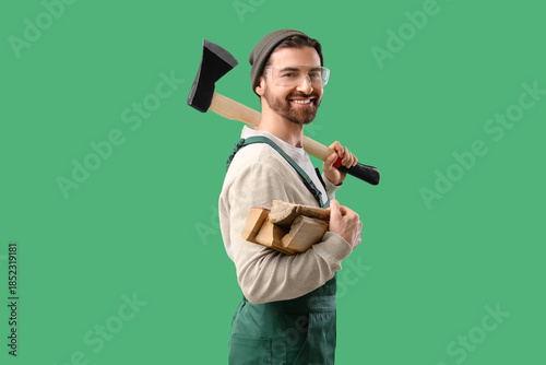 Male worker with ax and fir...