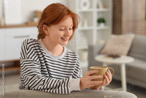 Teenage redhead girl with c...