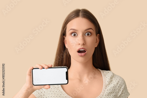 Surprised young woman with ...