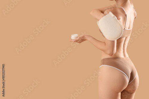 Young woman with cream mass...