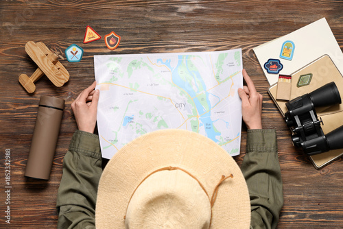 Female scout with city map ...