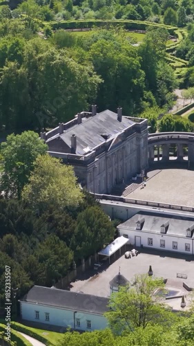 magnificent buildings parks ponds château seneffe visitors walking grounds add life scene reflecting site's popularity to left right pans aerial of de 