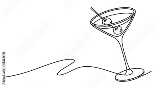 Elegant martini glass with olives on a cocktail table