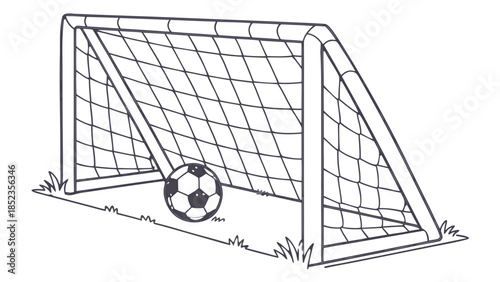 Soccer goal with ball on grassy field at night