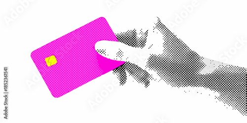 A cat playfully batting at a vibrant pink and yellow rectangular object