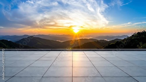Panoramic View of a Sunset Over Mountainous Terrain with a Concrete Surface in the Foreground