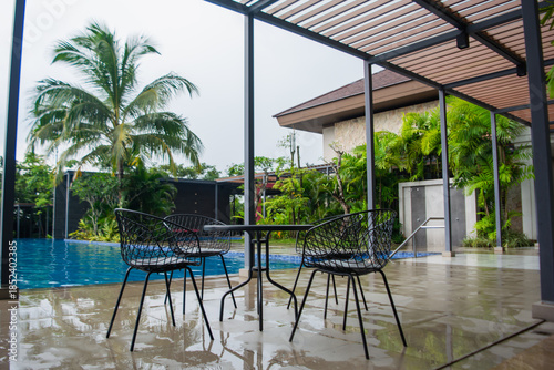 Table and chairs beside the swimming pool