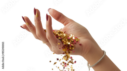 Hand holding falling gold and pink starshaped glitter confetti isolated on transparent background