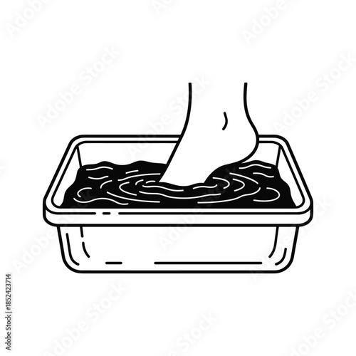 Foot in mud bath therapy relaxation wellness