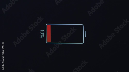 Detailed close-up of a smartphone display showing a low battery indicator, symbolizing power depletion and urgent charging need in everyday digital life