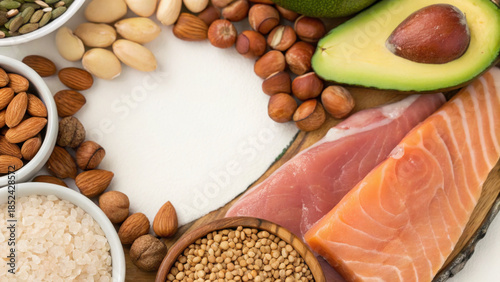 Intermittent Fasting Success Concept. Healthy fats and protein ingredients arranged in vibrant display, featuring salmon, nuts, and avocado
