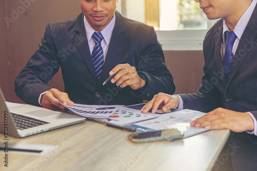 Businessmen discuss and explain their business plans to business partners to persuade them for invest together. Selected focus