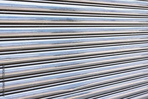 Shiny metallic roll up steel door pattern perspective background